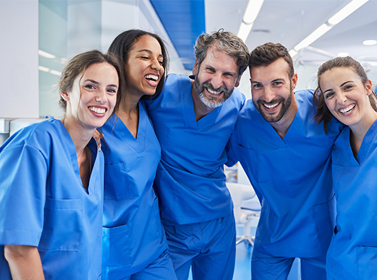 Group of individuals wearing scrubs