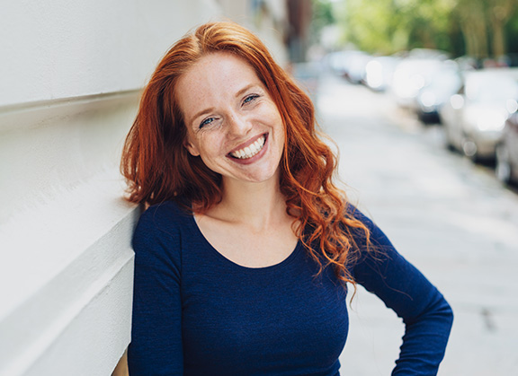 red-haired woman smiling