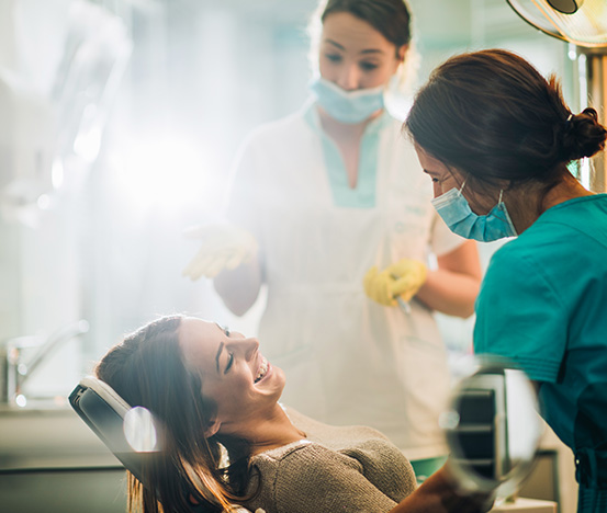 Doctors laughing with patient