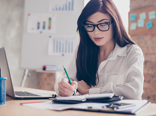 Woman with glasses doing her finances