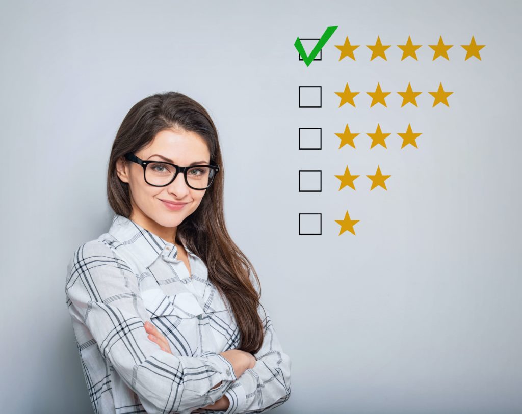 Lady standing next to 5-star review symbol